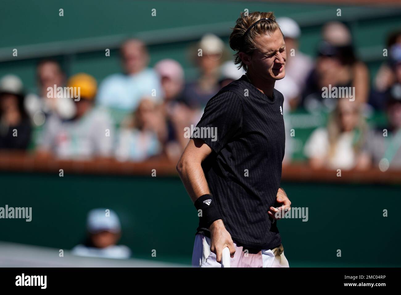 Sebastian Korda reacts after a shot to Rafael Nadal, of Spain, at the BNP Paribas Open tennis tournament Saturday, March 12, 2022, in Indian Wells, Calif