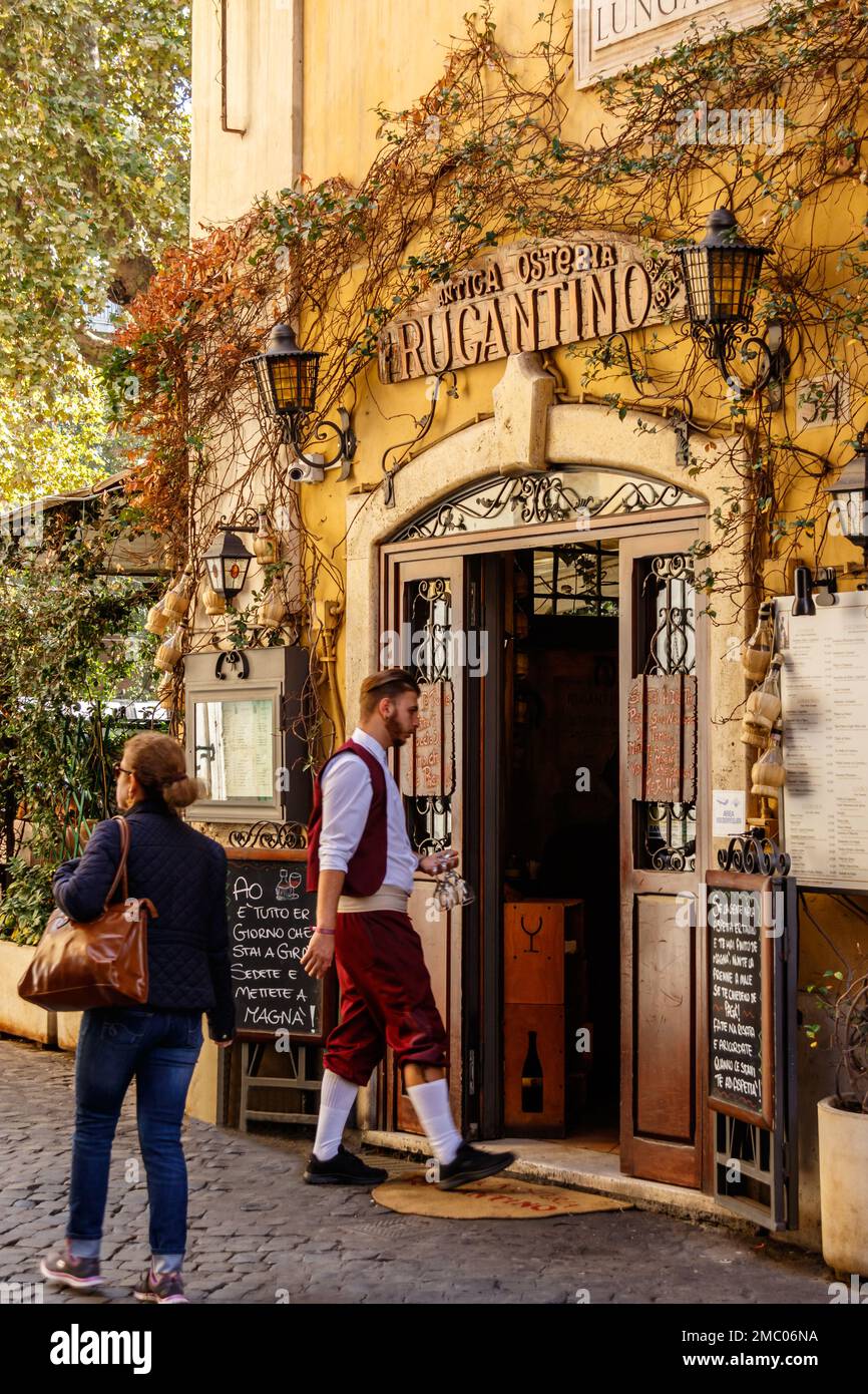 A waiter entering to an Antica Osteria at Trastevere, Rome, Italy Stock Photo