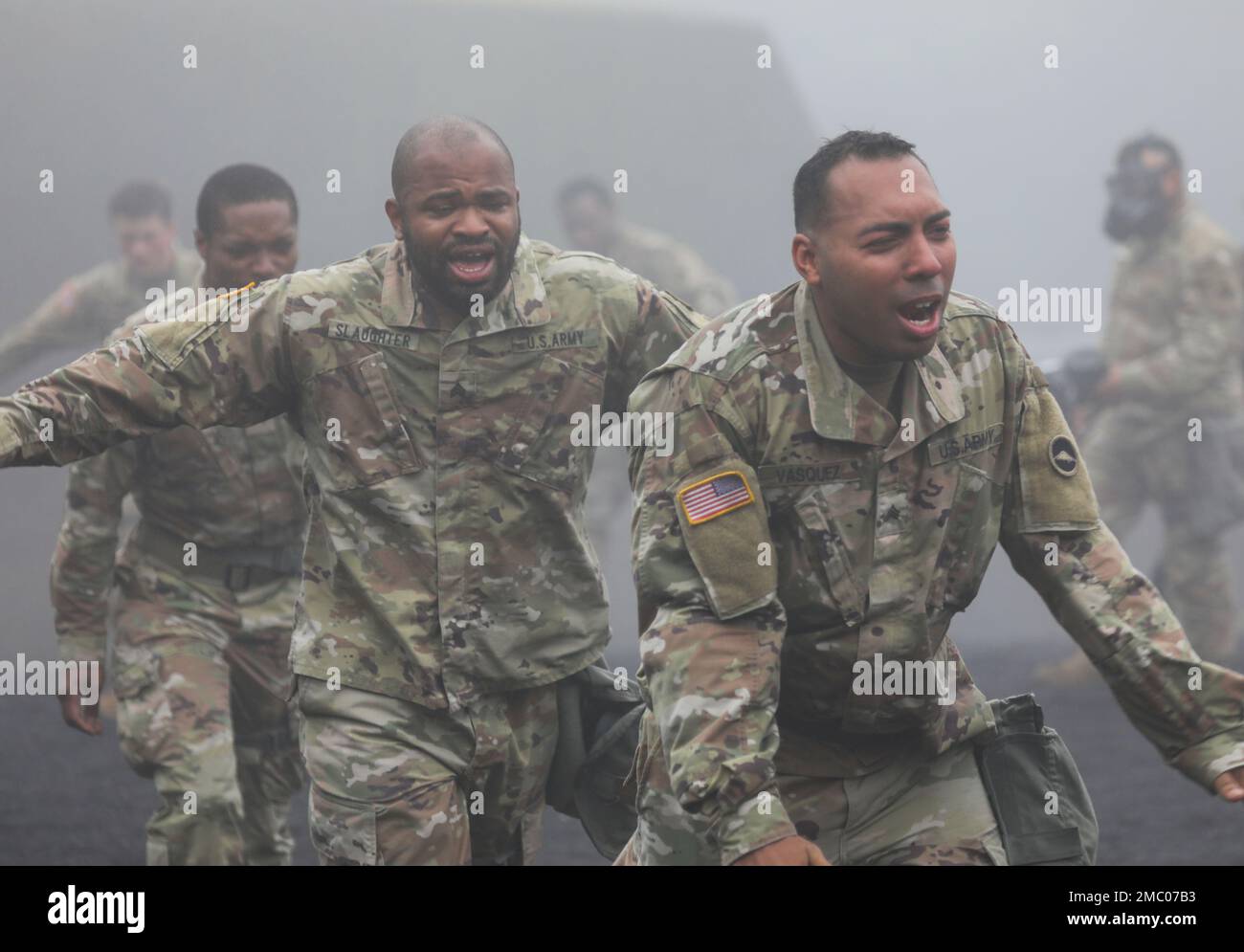 Sgt. Jamal Slaughter, center left, and Sgt. Nowell Vasquez exit a gas chamber during a training