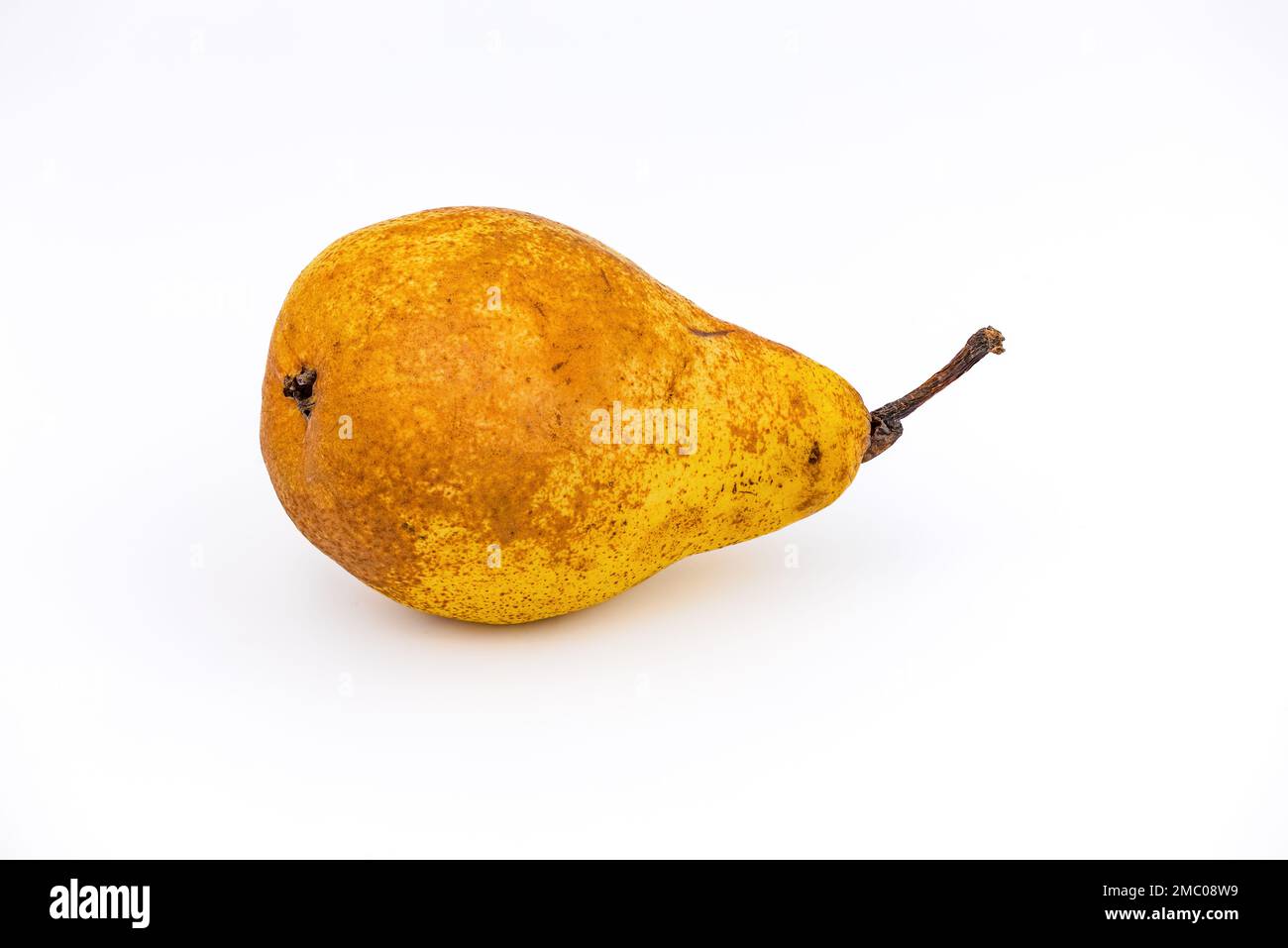 A ripe Williams Christ pear cropped against white background and photographed with focus stacking in studio Stock Photo