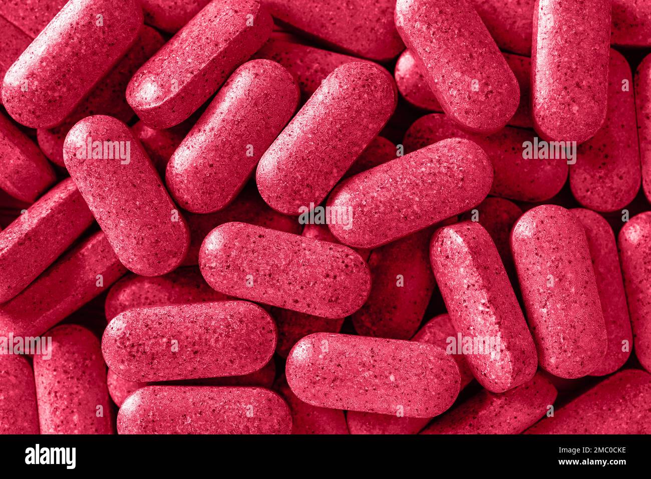 Multivitamin everyday pills toned viva magenta color. Heap of daily