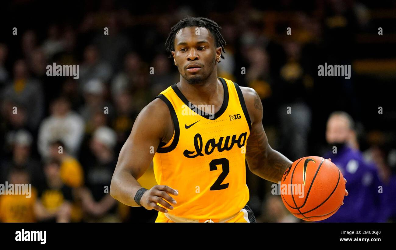 Iowa guard Joe Toussaint drives up court during an NCAA college