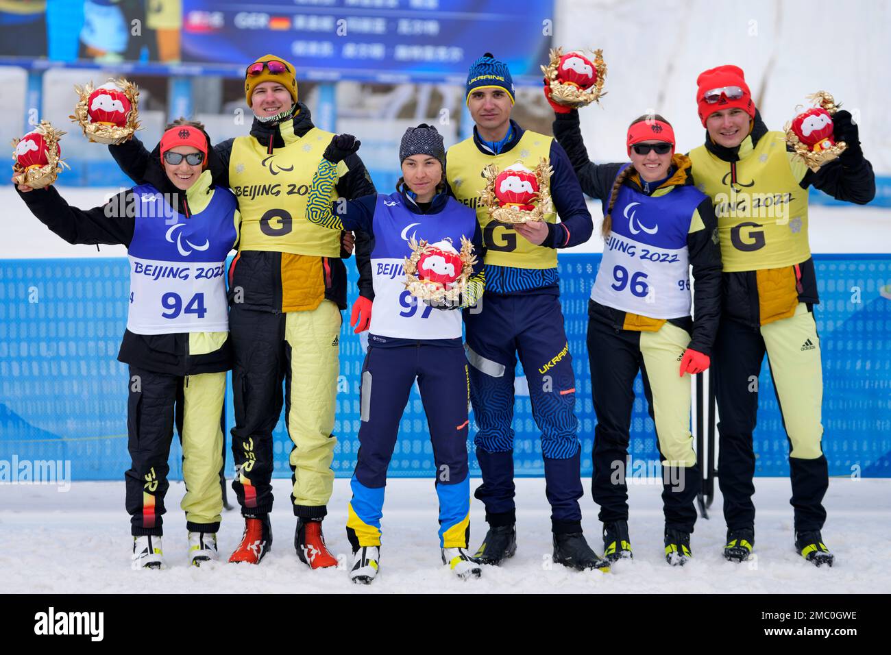 Gold medalist Ukraine's Oksana Shyshkova, center left, with guide ...