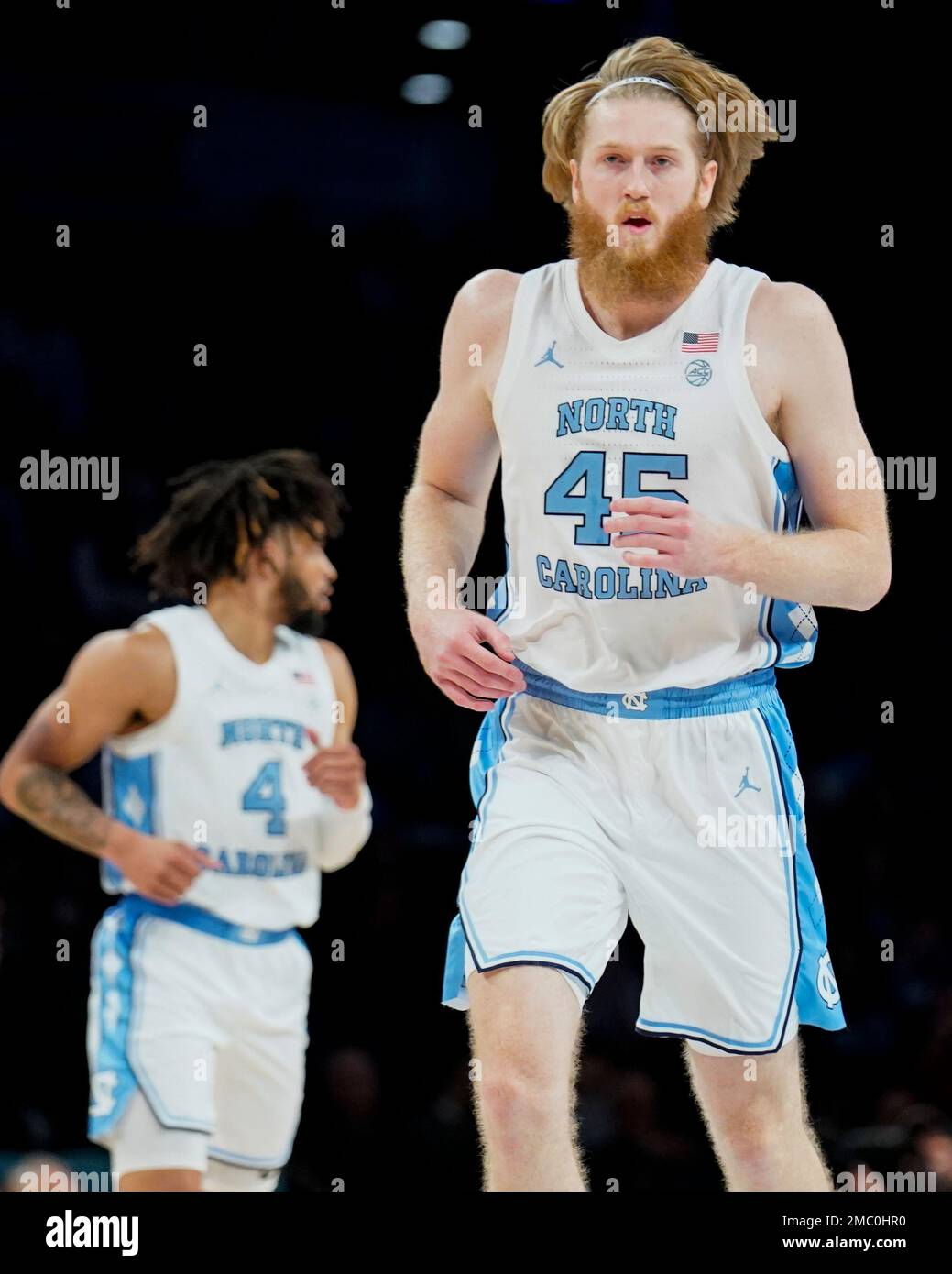North Carolina's Brady Manek (45) runs up the court in the first half