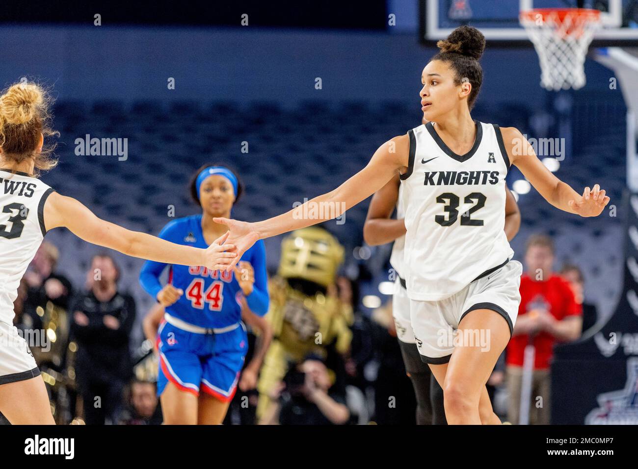 Central Florida forward Brittney Smith (32) highfives teammate Alisha