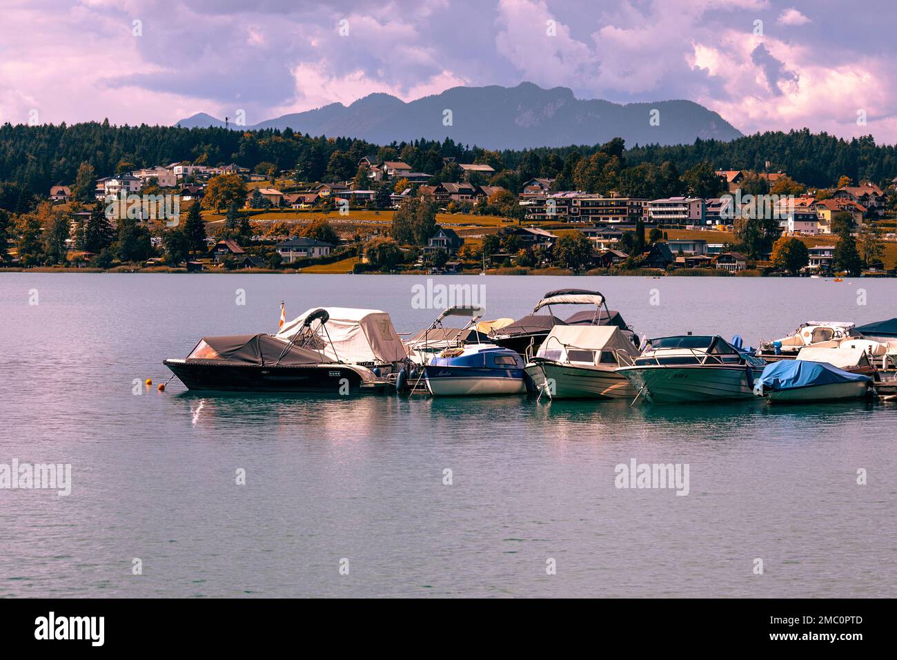 Villach, Austria - 2022 September 4 : Faaker See, small village on the lake, boat parking, Austria Stock Photo