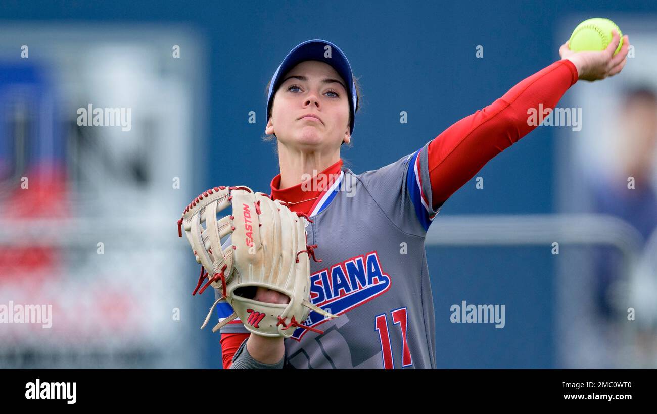Louisiana Tech outfielder Katelin Cooper (17) throws during an NCAA