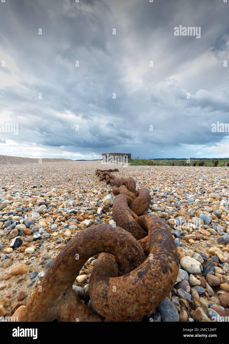 Pillbox defence and anchor chain at Rye Harbour beach Stock Photo Alamy