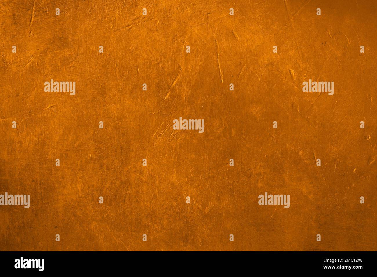 Golden plaster wall grunge background Stock Photo