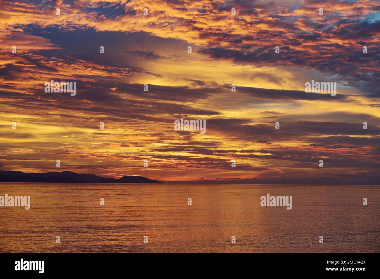 Mesmerising sunset over the Raja Ampat Islands West Papua, Indonesia Stock Photo