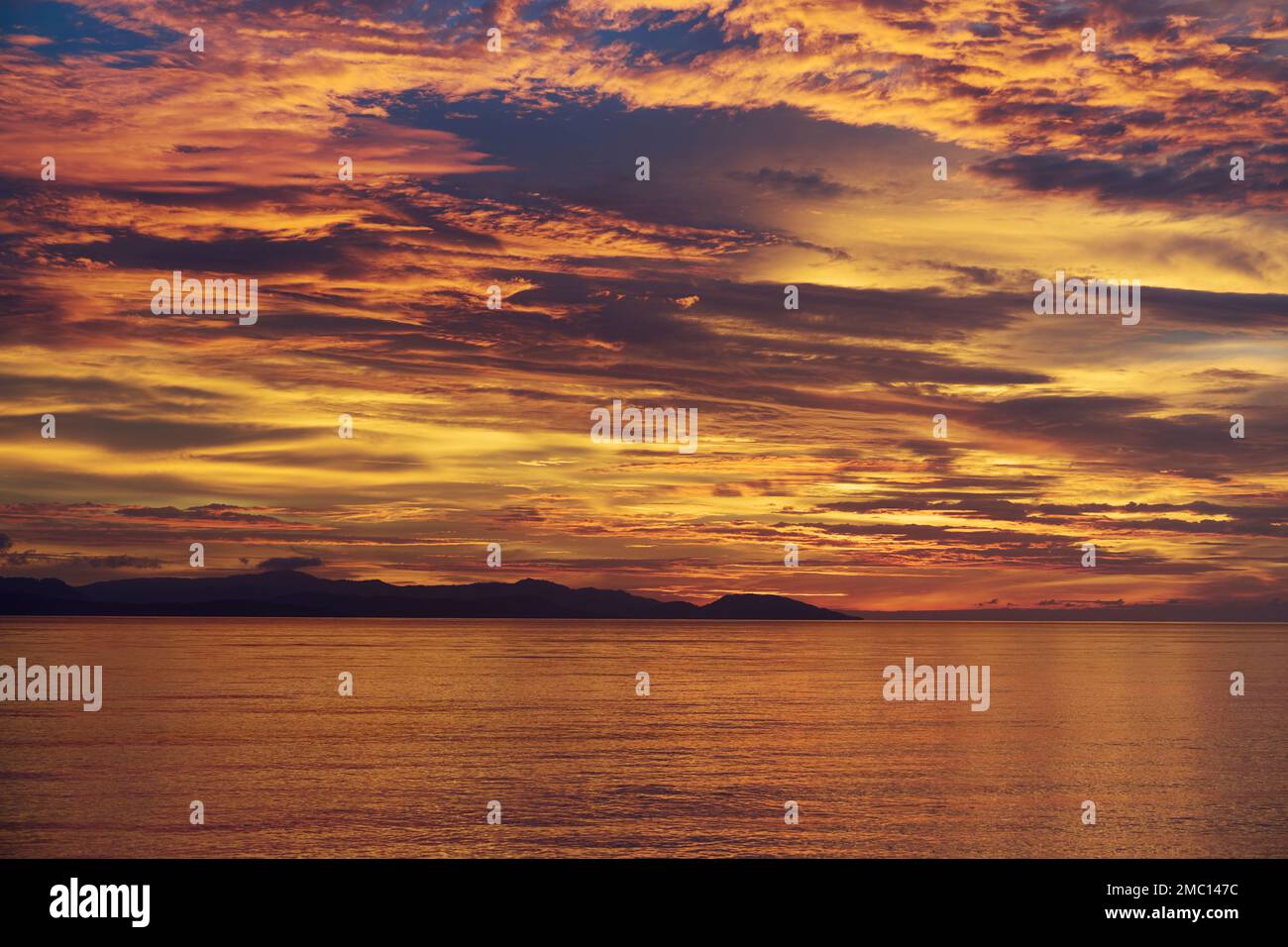 Mesmerising sunset over the Raja Ampat Islands West Papua, Indonesia Stock Photo