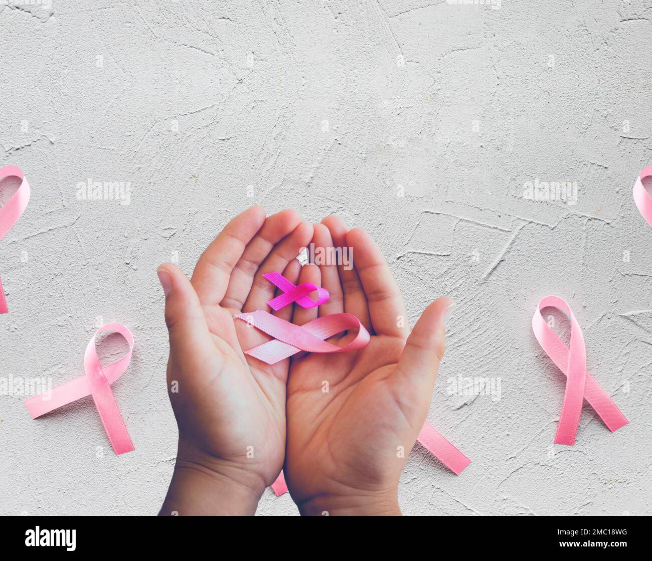 World cancer day, fight against cancer concept, solidarity hands, hands with cancer ribbons Centroamerica, Nicaragua Stock Photo