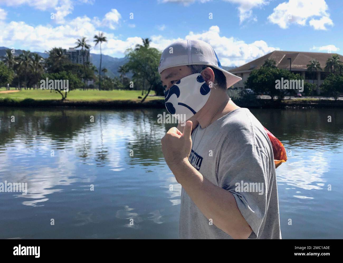 FILE Ricardo Lay 52 wearing an aloha print mask poses for a