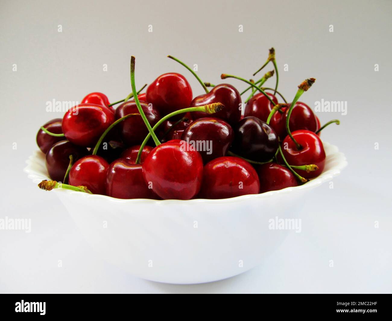Cherries in skin Stock Photo Alamy