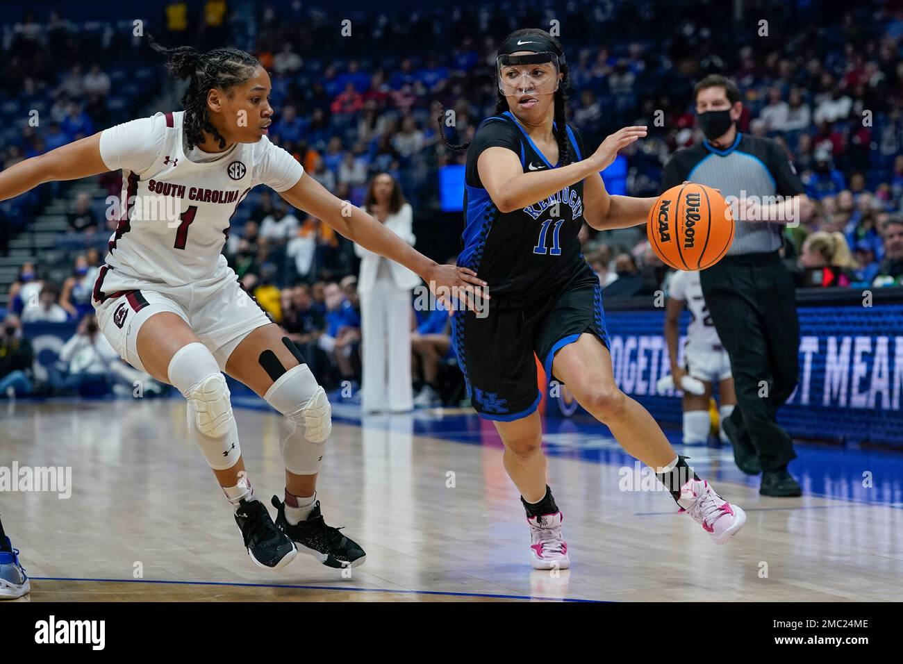 Kentucky's Jada Walker (11) drives against South Carolina's Zia Cooke (1) in the first half of