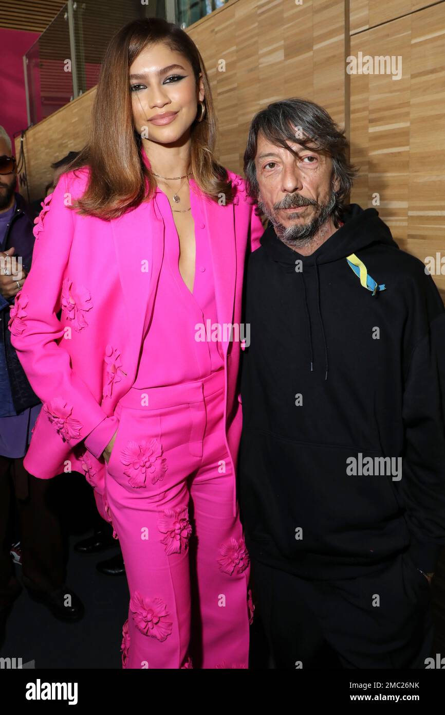 Zendaya, left, and Pierpaolo Piccioli, who is wearing a ribbon in support of Ukraine, photographers after the Valentino Ready To Wear Fall/Winter 2022-2023 fashion collection, unveiled during the Fashion Week