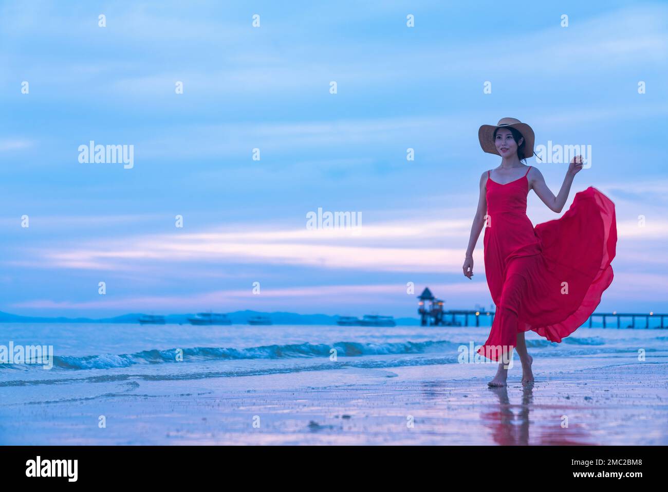 Happy young woman on the beach Stock Photo - Alamy