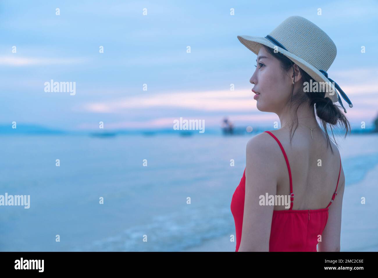 Happy young woman on the beach Stock Photo - Alamy