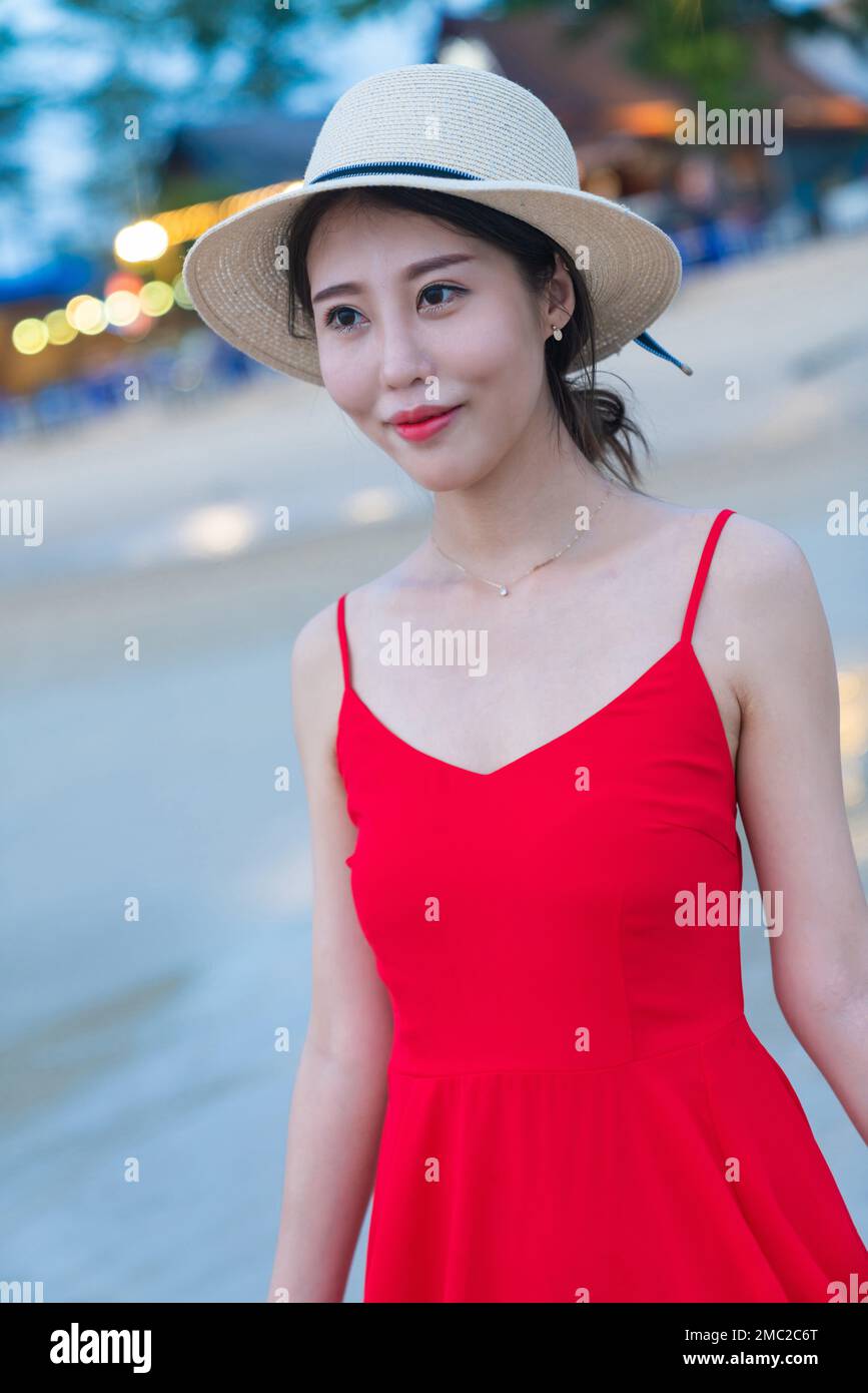Happy young woman on the beach Stock Photo - Alamy