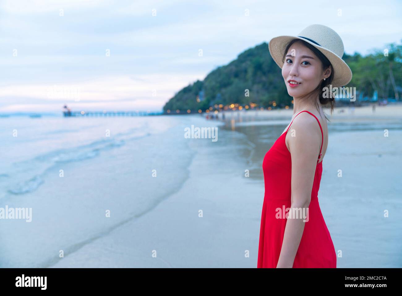 Happy young woman on the beach Stock Photo - Alamy
