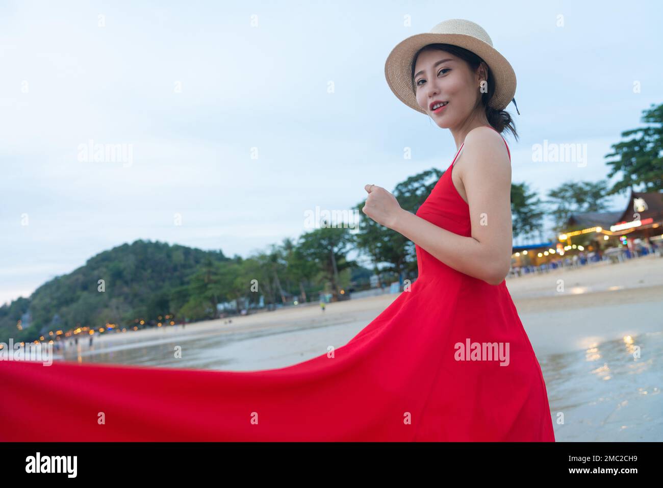 Happy young woman on the beach Stock Photo - Alamy