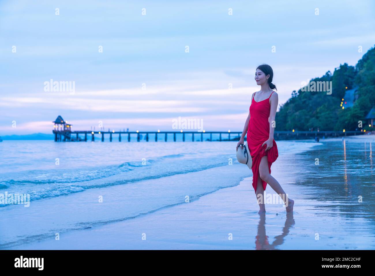 Happy young woman on the beach Stock Photo - Alamy