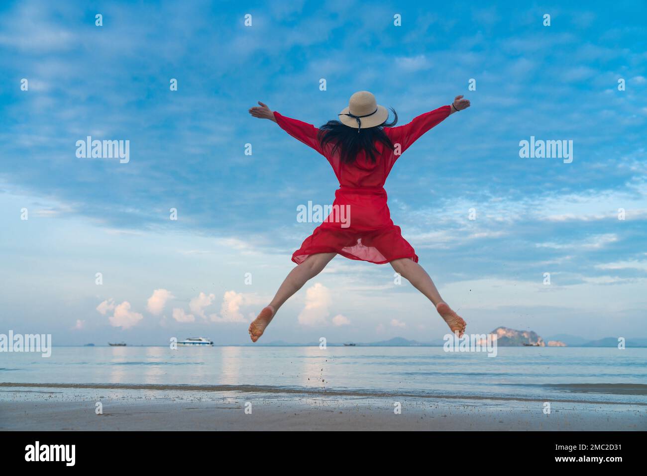 Happy young woman on the beach Stock Photo - Alamy