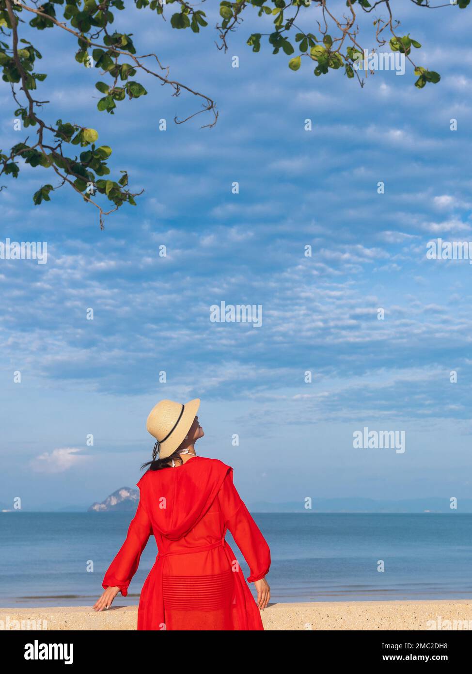 Happy young woman on the beach Stock Photo - Alamy