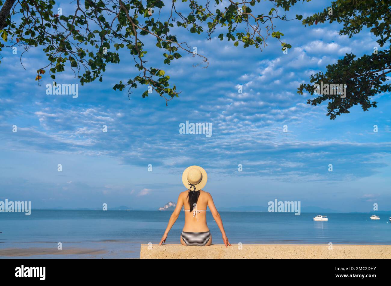 Happy young woman on the beach Stock Photo - Alamy