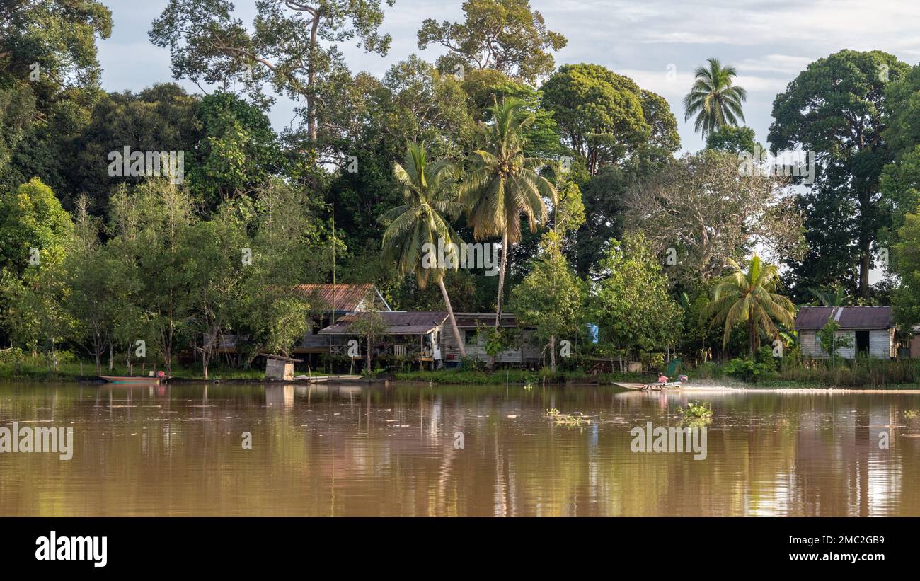 View of Rural Village along Kinabatangan River, Borneo, Malaysia Stock Photo