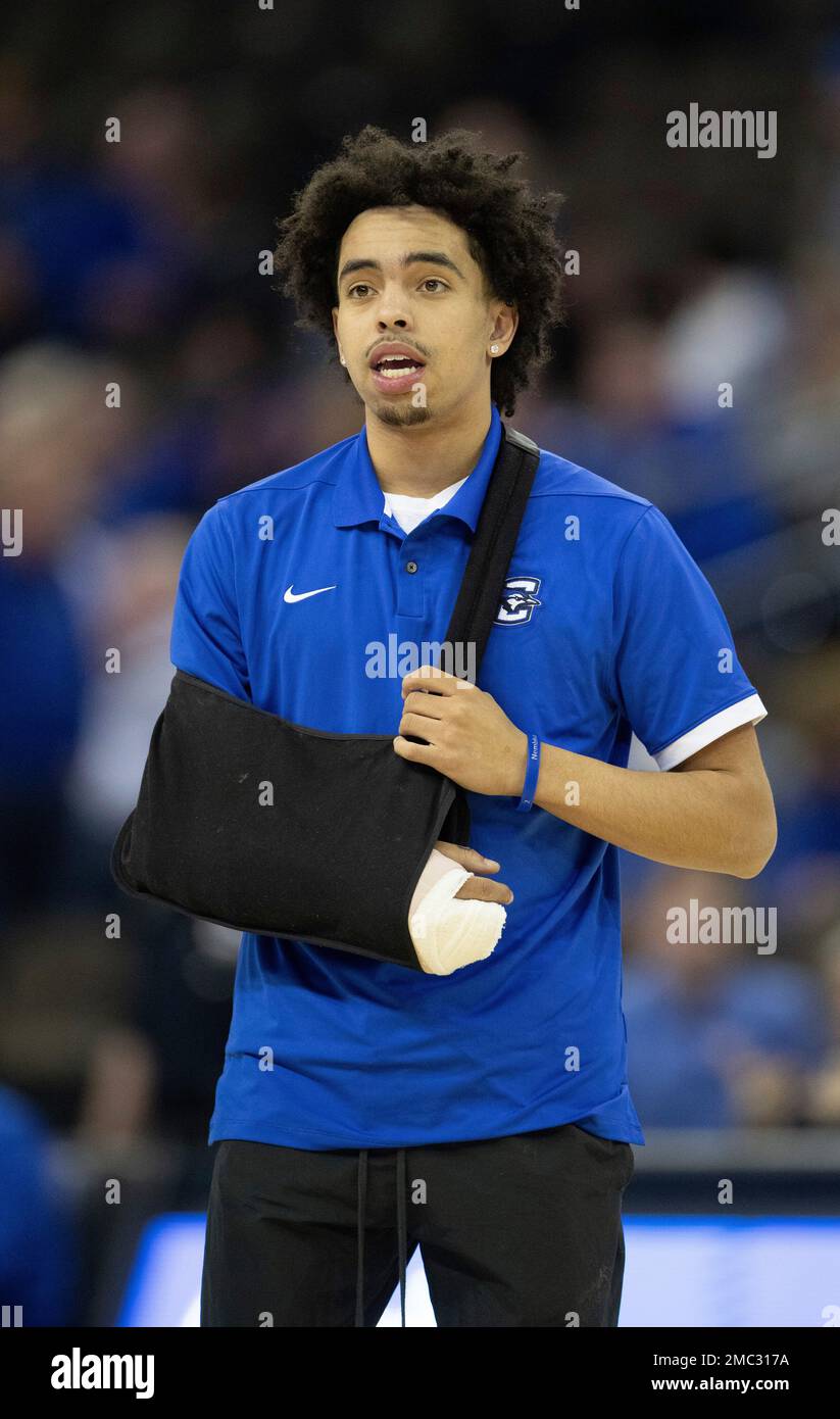 While sidelined with an injury, Creighton's Ryan Nembhard watches his team warm up before playing against Connecticut in an NCAA college basketball game Wednesday, March 2, 2022, in Omaha, Neb. (AP Photo/Rebecca S. Gratz) Stock Photo