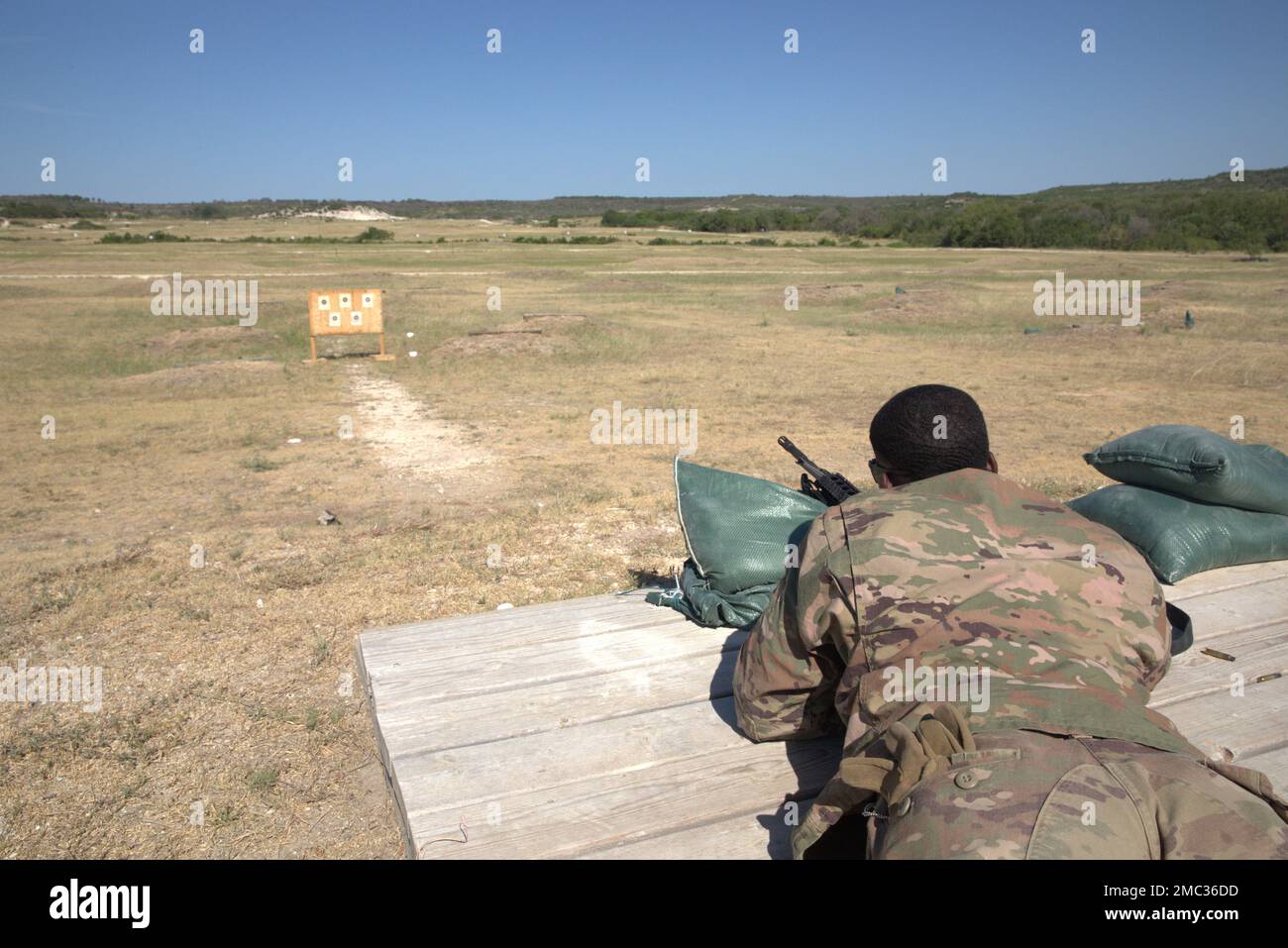 Sgt. Isiah Brown, an Army cable systems installer and maintainer assigned to the 11th Corps Signal Brigade, zeroes his M4 carbine rifle during the III Armored Corps Best Squad Competition 2022 on Fort Hood, Texas, June 24, 2022. Soldiers must align the sights on a weapon to maximize its accuracy during the qualification test. Brown tests the weapon's accuracy by shooting practice targets downrange and adjusts his weapon if he needs to, depending on how many rounds hit the target. The III Armored Corps pulled only the best from across its divisions and separate brigade’s to compete in this year Stock Photo