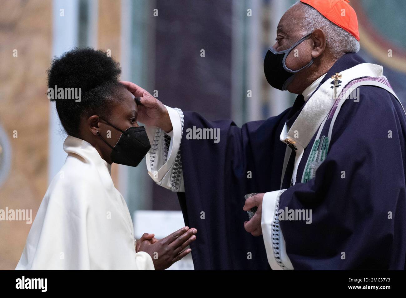 Cardinal Wilton Gregory, Archbishop of Washington places ashes on the  forehead of parishioners duringthe Ash Wednesday mass which marks the  beginning of Lent at Saint Matthew the Apostle Cathedral in Washington,  Wednesday