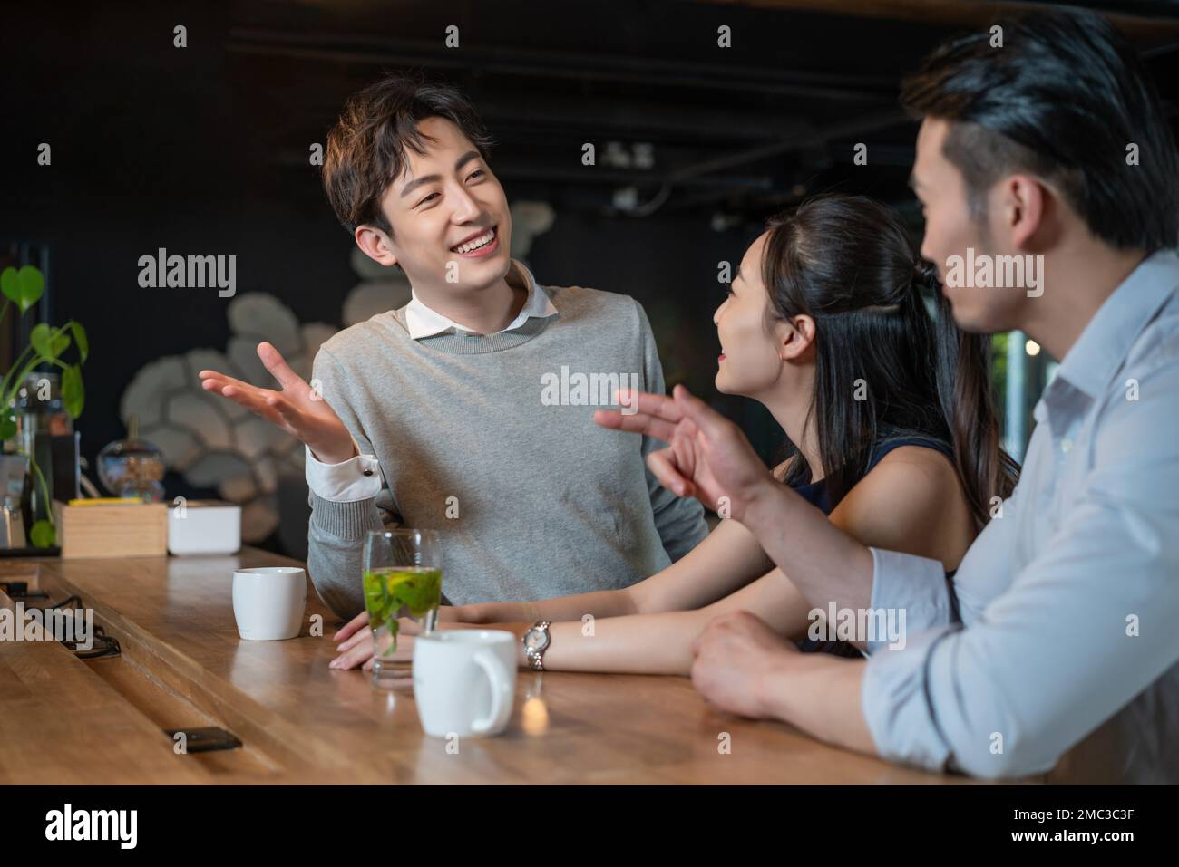 Friends sharing hot drinks hi-res stock photography and images - Alamy