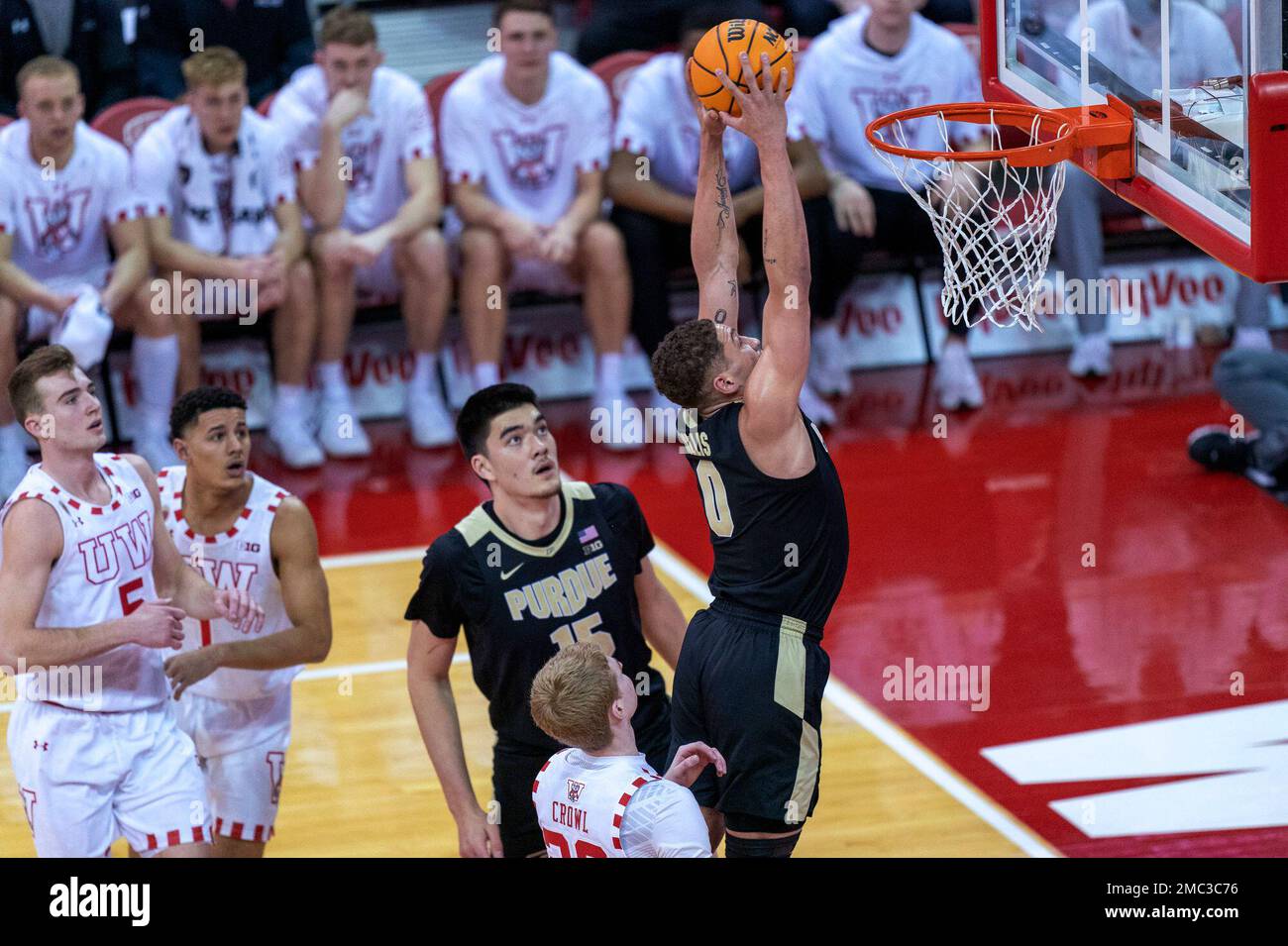 Purdue's Mason Gillis (0) dunks past Wisconsin's Steven Crowl (22