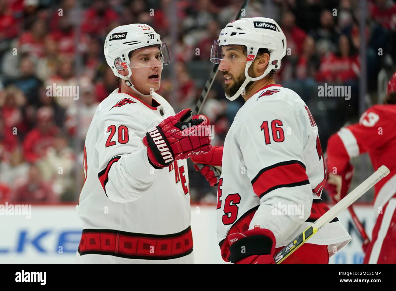 Carolina Hurricanes center Sebastian Aho (20) celebrates his goal with Vincent Trocheck (16) against the Detroit Red Wings in the first period of an NHL hockey game Tuesday, March 1, 2022, in