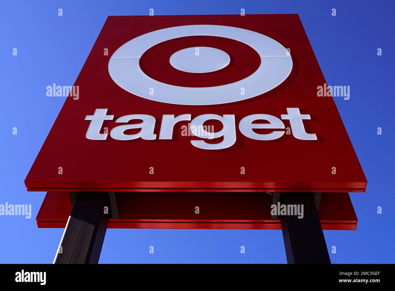 The bullseye logo on a sign outside the Target store in Quincy, Mass., Monday, Feb. 28, 2022. Target pushed through headwinds — from inflation to congested ports — to deliver solid results for the three-month period that included the crucial holiday shopping season. The Minneapolis-based discount retailer reported Tuesday that its fiscal fourth-quarter profits rose nearly 12%, while sales increased 9.4%. (AP Photo/Charles Krupa) Stock Photo