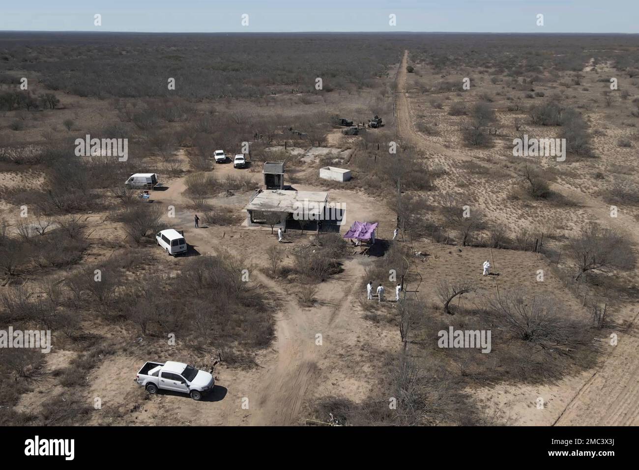 Forensic technicians excavate a field where uncounted of human bone  fragments are spread across 75,000 square feet of this desert scrubland, on  the outskirts of Nuevo Laredo, Mexico, Tuesday, Feb. 8, 2022.