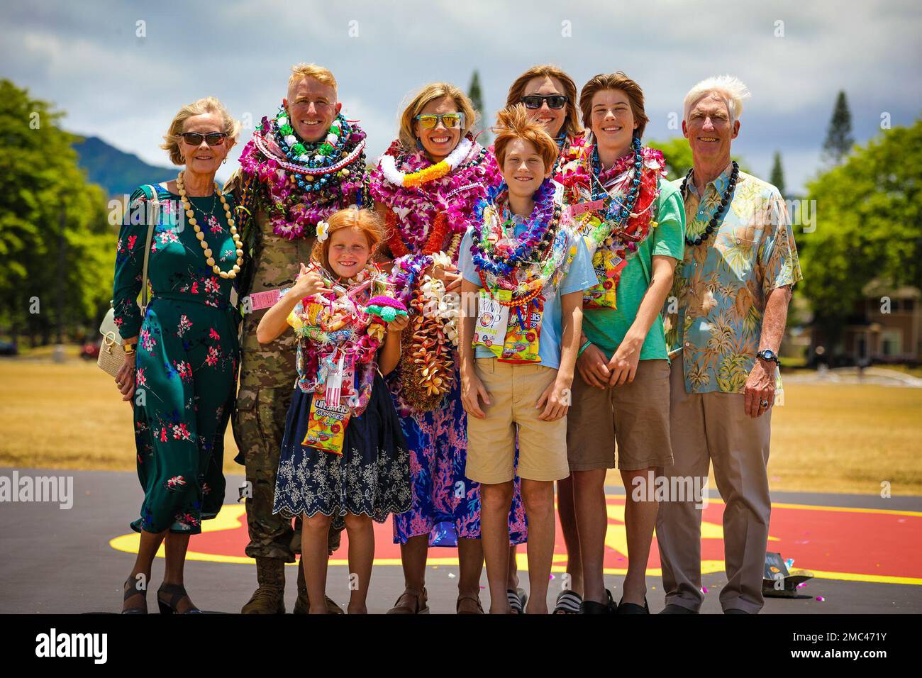 The 3rd Infantry Brigade Combat Team, 25th Infantry Division outgoing Commander Col. Josh Bookout poses for a picture with his wife, kids and parents upon the conclusion of the Bronco Brigade change of command ceremony between himself and incoming commander Col. Rob Shaw at Schofield Barracks, Hawaii, June 24, 2022. Stock Photo