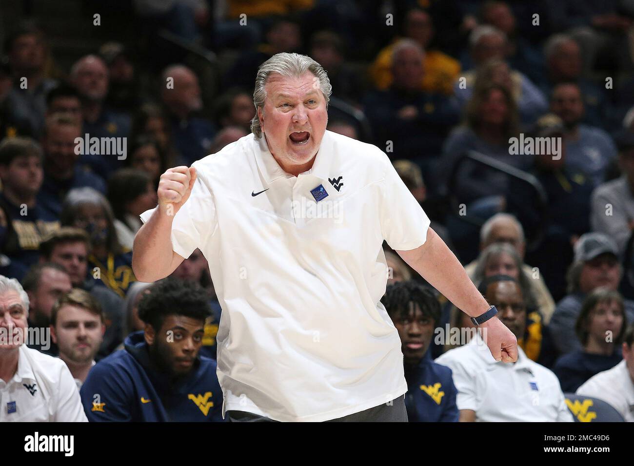 West Virginia coach Bob Huggins reacts during the first half of an NCAA