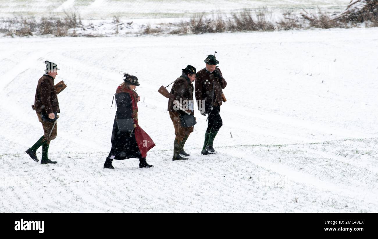 Gammelsdorf, Germany. 21st Jan, 2023. Boeller gunners walk across a  snow-covered field. Several hundred participants came to the winter patriot  meeting of the Association of Königstreuen in Bavaria to commemorate the  Battle