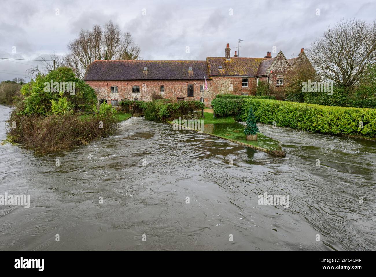 Breamore Mill House over high River Avon, Breamore, Hampshire, England, UK, January, 2023 Stock Photo