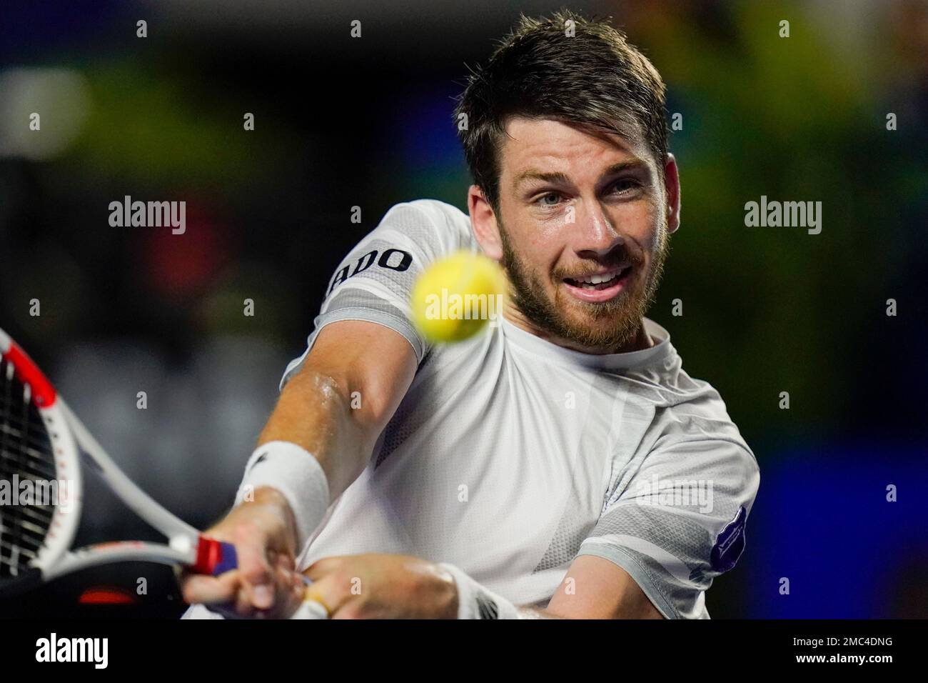 Britains Cameron Norrie returns a ball during his semifinal match against Greeces Stefanos Tsitsipas at the Mexican Open tennis tournament in Acapulco, Mexico, Friday, Feb
