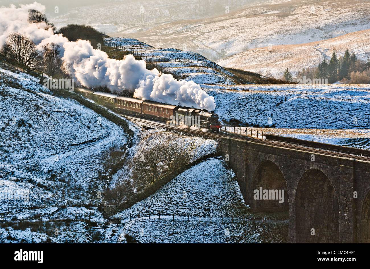 The first steam special of 2023 on the famous Settle-Carlisle railway line. 'The Winter Cumbrian Mountain Express' was hauled by Black Five steam locomotive 44932, from Manchester to Carlisle and back.  The train is seen here at Arten Gill Viaduct, in Dentdale, on the Settle-Carlisle line. Credit: John Bentley/Alamy Live News Stock Photo