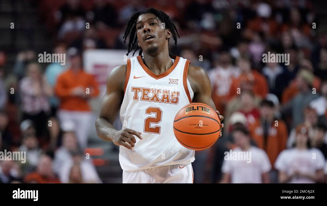 Texas guard Marcus Carr (2) brings the ball up the court against TCU