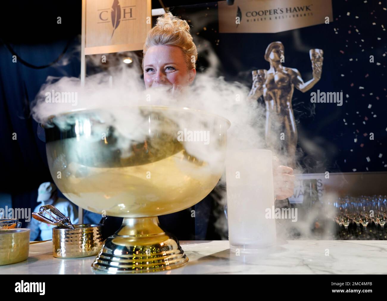 Emily Wines, head sommelier for Cooper's Hawk Winery makes a "froze