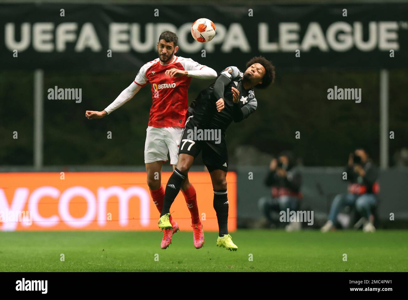 Bragas Vitor Tormena, left, and Sheriffs Bruno jump for the ball during the Europa League playoff, second leg, soccer match between SC Braga and Sheriff Tiraspol at the Municipal stadium in Braga,
