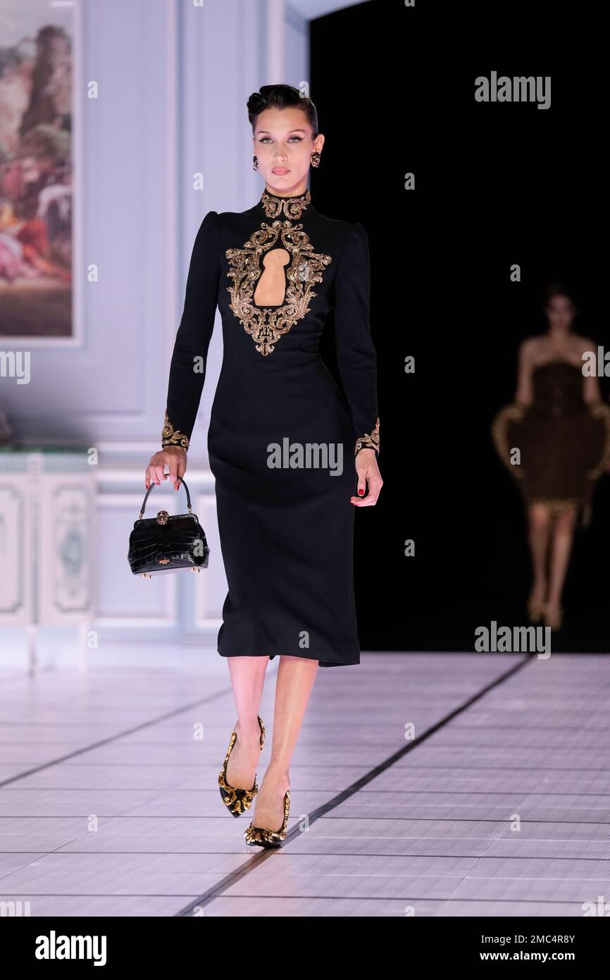 Bella Hadid wears a creation as part of the Moschino Fall/Winter 2022-2023  fashion collection, unveiled during the Fashion Week in Milan, Italy,  Thursday, Feb. 24, 2022. (AP Photo/Antonio Calanni Stock Photo - Alamy