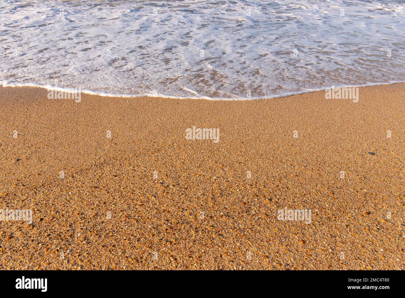 Wave on the beautiful yellow sand. Caspian Sea. Stock Photo