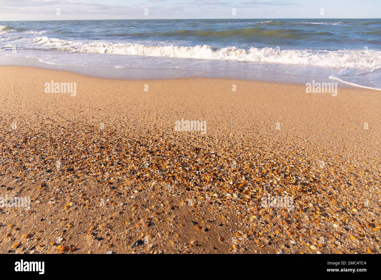 Wave on the beautiful yellow sand. Caspian Sea. Stock Photo